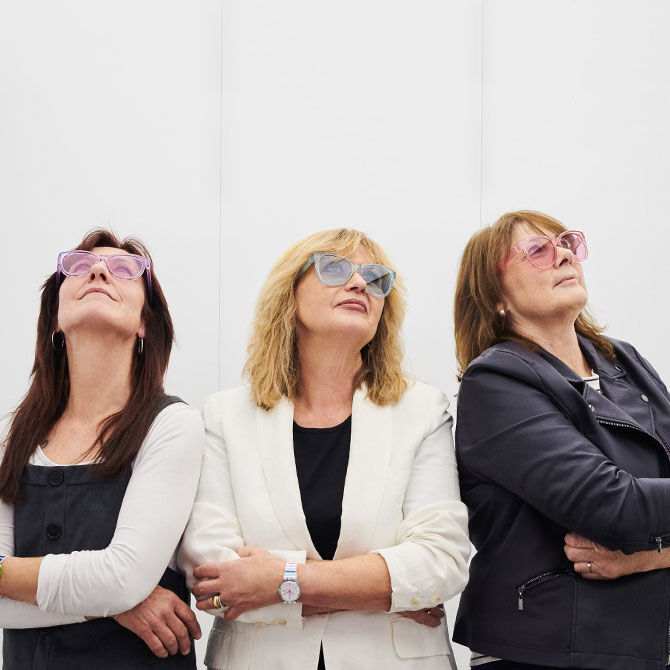 Three women wearing The Eyes Glasses